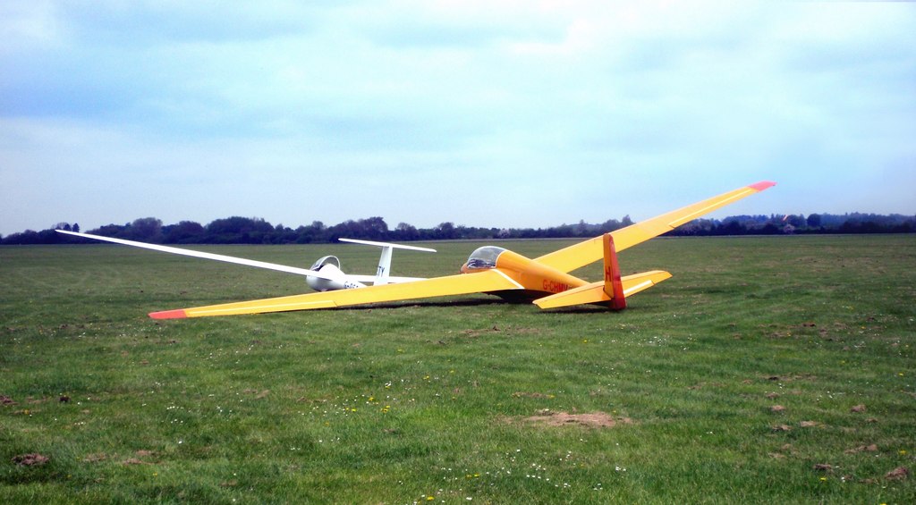 Two gliders parked on the expansive grass flying field at RAF Bicester airfield, photographed in May 2013.