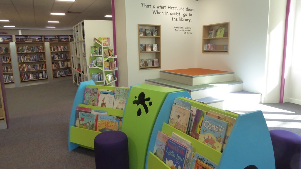 Children's section and storytelling space with books and seating inside Bicester Library at Franklins House, photographed in July 2016.