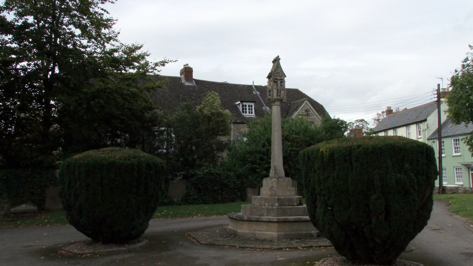 The stone War Memorial cross in St Edburg's Churchyard in Bicester, photographed in September 2012.