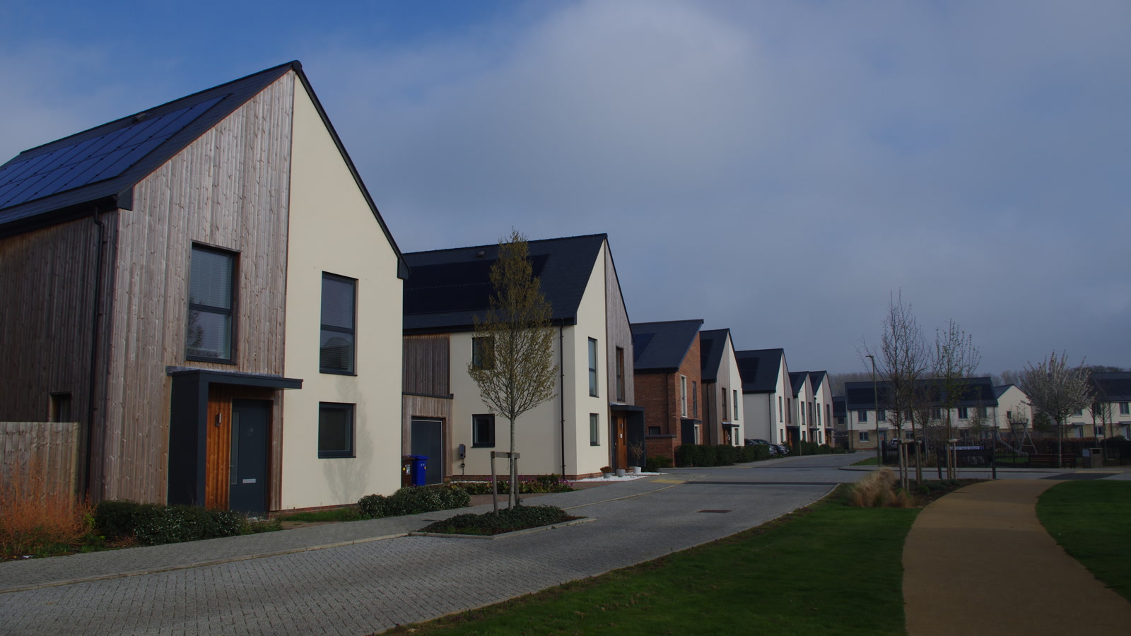 Modern sustainable houses with solar panel roofs at Elmsbrook eco-village in Bicester.