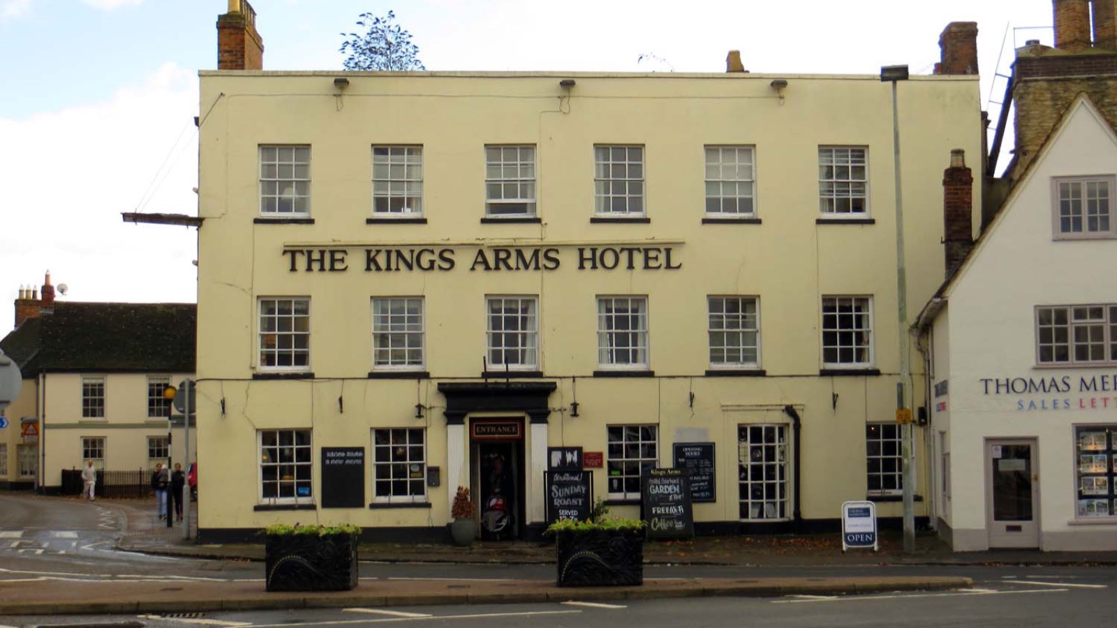 Exterior facade of The Kings Arms Hotel on Market Square in Bicester, showing its three-storey Georgian frontage and sash windows, photographed in November 2013.