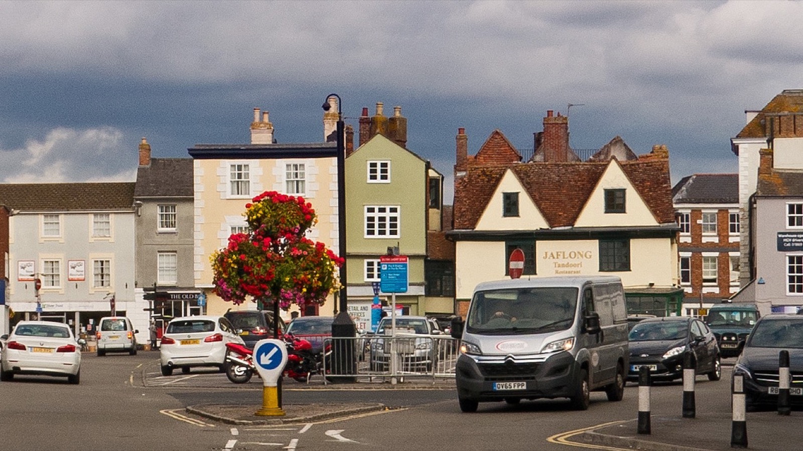 Bicester Market Square viewed across the central junction towards the historic gabled and Georgian buildings, photographed in September 2019.