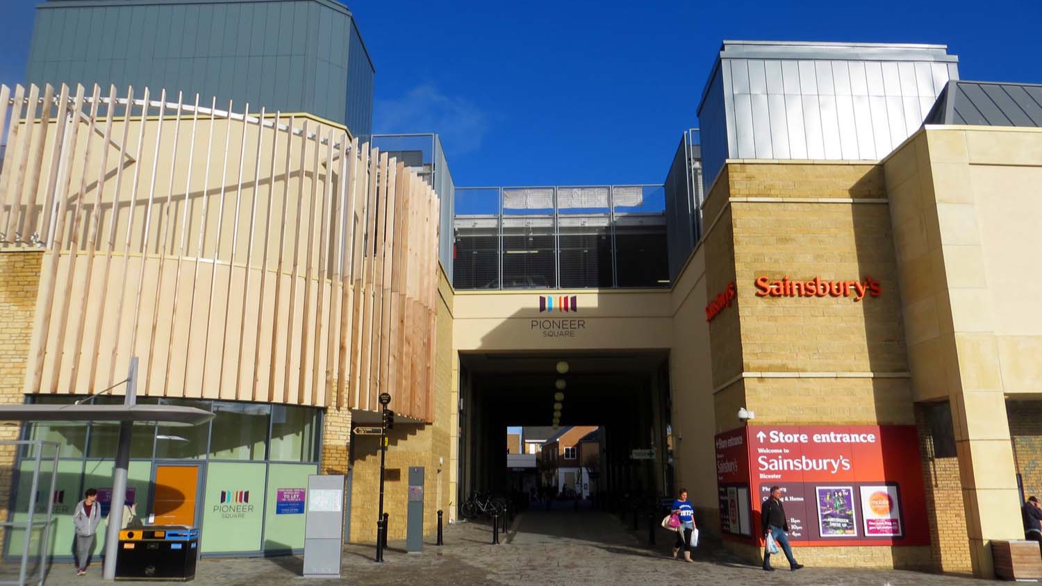 Pedestrian entrance walkway to Pioneer Square retail and leisure development from Manorsfield Road in Bicester, photographed in October 2013.