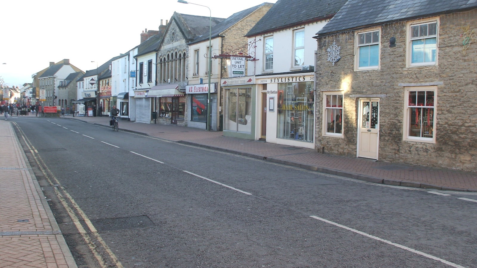 View along Sheep Street showing high street independent shops and commercial premises in Bicester.