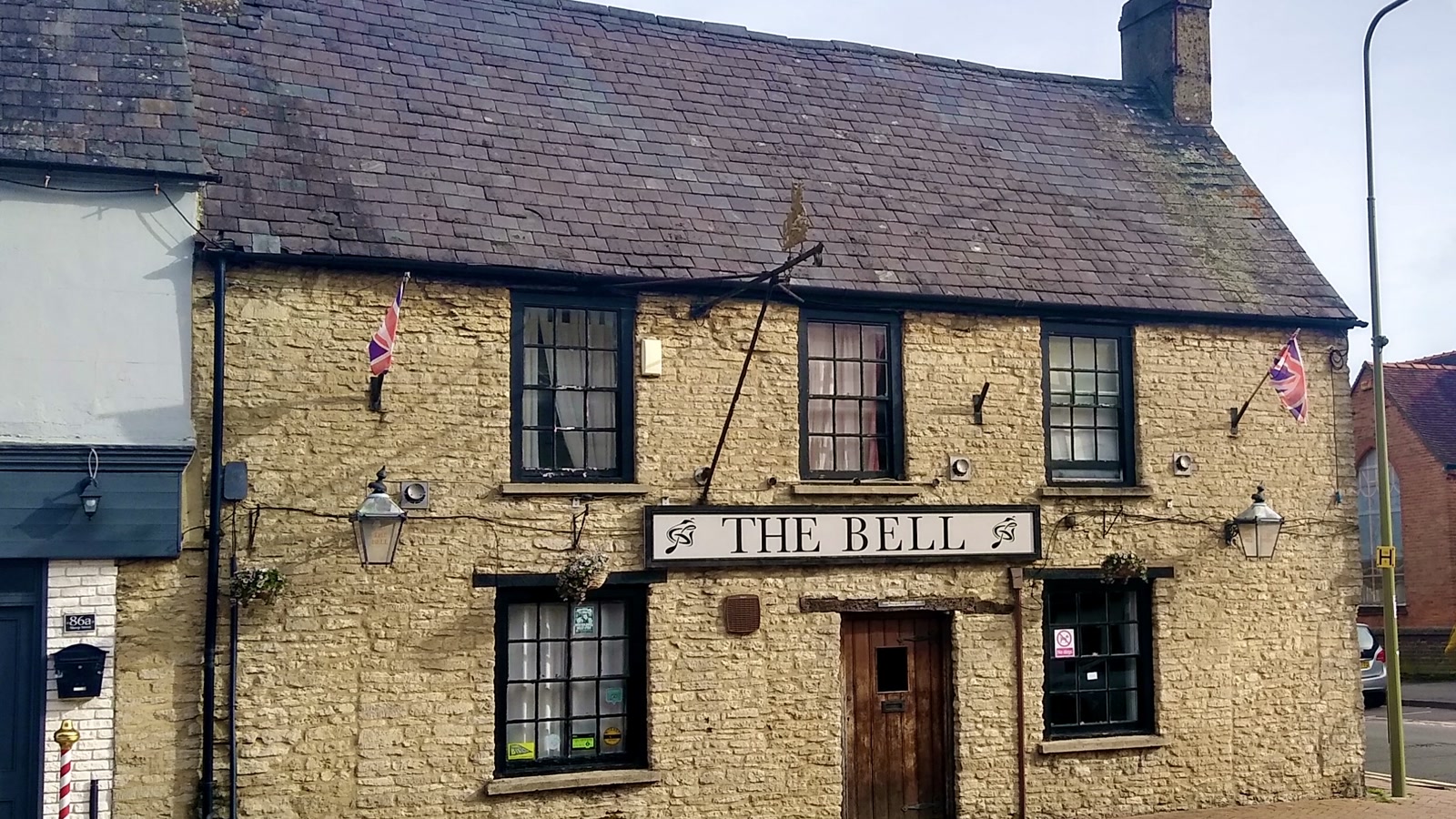 The Bell, a 16th-century Grade II listed stone pub on Sheep Street along the Bicester heritage trail.